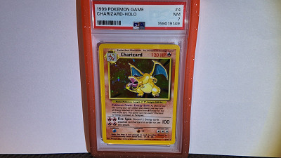 PSA 7 Charizard #4/102 • Base Set Unlimited or £700